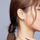 Boucle d'oreille en forme de trèfle