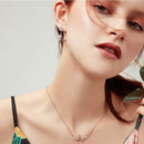 Boucles d'oreilles pendantes fleurs et papillons