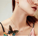 Boucles d'oreilles pendantes fleurs et papillons