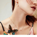 Collier fleur papillon