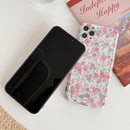 coque iPhone fleurie et colorée