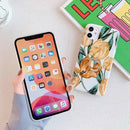 Coque iPhone fleurs brunes