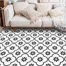 Tapis fleuri noir et blanc